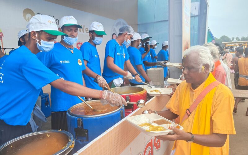 Food being  served to devotees as part of Reliance Foundation’s Anna Seva initiative in Puri